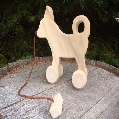Child Play - Unfinished Pine Pull-Toy Dog - Amish handcrafted wooden pull toy dog, measures approximately 8" l x 8" w x 3" d. Lead-free and unfinished - it is a quality made pull-toy that will be enjoyed for years to come.
