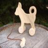 Child Play - Unfinished Pine Pull-Toy Dog - Amish handcrafted wooden pull toy dog, measures approximately 8" l x 8" w x 3" d. Lead-free and unfinished - it is a quality made pull-toy that will be enjoyed for years to come. view 1