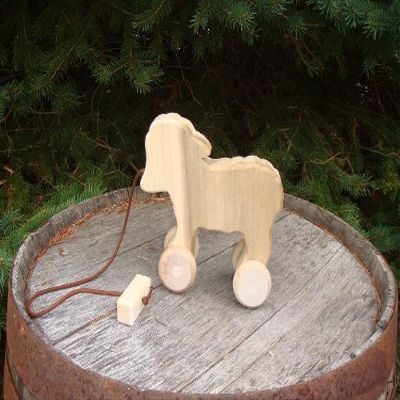 Child Play - Amish handcrafted wooden pull toy lamb, measures approximately 9" l x 7" w x 3" d. Lead-free and unfinished - it is a quality made pull-toy that will be enjoyed for years to come.