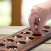 Yellow Mountain Imports Mancala Set with 17.3-Inch Solid Wood Board and Quartz Pebble Playing Pieces view 3
