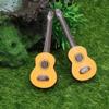 Wooden Mini Guitar Toy Ornament: 2Pcs Toy Guitar Ornaments Musical Instrument Photo Props for Dollhouse Accessories Desktop Music Decoration 2.55 Inch view 2