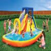 BANZAI Inflatable 13' Water Slide Park Plus 12' Bounce House 2 for 1 Value Pack w Free Air Blower- Inflates in Under 2min- Heavy Duty Kids Adventure Park Pool with Sprinkler 12x9 XL Bouncy Castle view 2