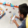 Hot Wheels Toy Cars & Track Set, HW Celebration Box of 6 1:64 Scale Vehicles, Track, Connectors, 4-Speed Launcher, Ramps, Activity Page & Stickers view 2