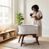 TruBliss Evi Smart Baby Bassinet Beside Sleeper with Auto-Glide, Ambient Nightlight & Sensory Sounds, Compatible with Alexa and Google Home, Includes 2 Sheets (Soft White w/Espresso Legs) view 2