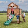 Backyard Discovery Echo Heights Elevated Cedar Wooden Kids Playhouse with Wave Slide, Play Kitchen, Wrap-Around Deck, Flat-Step Ladder, Half Door, Windows, Bell, and Growth Chart for Outdoor Play view 2