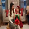 Barbie Signature 2022 Holiday Doll, Dark-Brown Wavy Hair Wearing Red Poinsettia-Inspired Gown, Collectible with Doll Stand & Certificate of Authenticity view 2