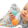 Ludi - Handling Cube - Early Learning Toys for Babies from 10 Months - Develops Thought, Fine Motor Skills, Touch & Discovery - 1 Elastic Cube + 12 Orange & Blue Balls with Funny Sound view 3