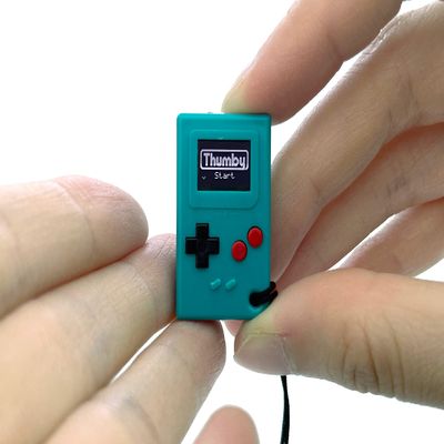 TinyCircuits | Thumby Programmable Game Console Keychain  Retro Gaming Fun Mini-Console, STEM Learning, USB Rechargeable, 5 Preloaded Games (Teal)