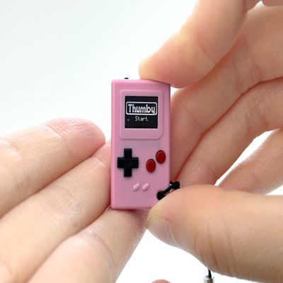 TinyCircuits | Thumby Programmable Game Console Keychain  Retro Gaming Fun Mini-Console, STEM Learning, USB Rechargeable, 5 Preloaded Games (Pink