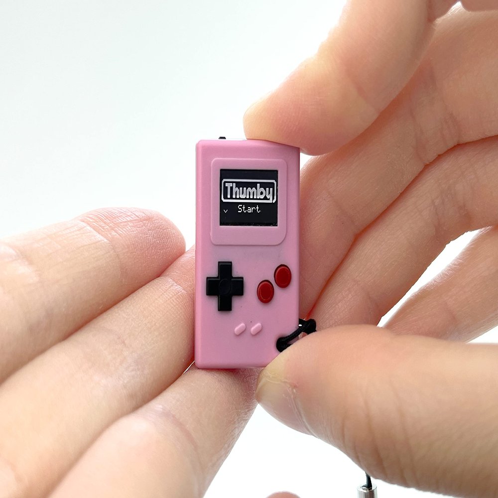 TinyCircuits | Thumby Programmable Game Console Keychain  Retro Gaming Fun Mini-Console, STEM Learning, USB Rechargeable, 5 Preloaded Games (Pink