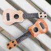 Toddmomy Children Ukulele Toy 9.84 Inch Plastic 4-String Musical Instrument Educational Toy for Kids Beginner Learning view 3