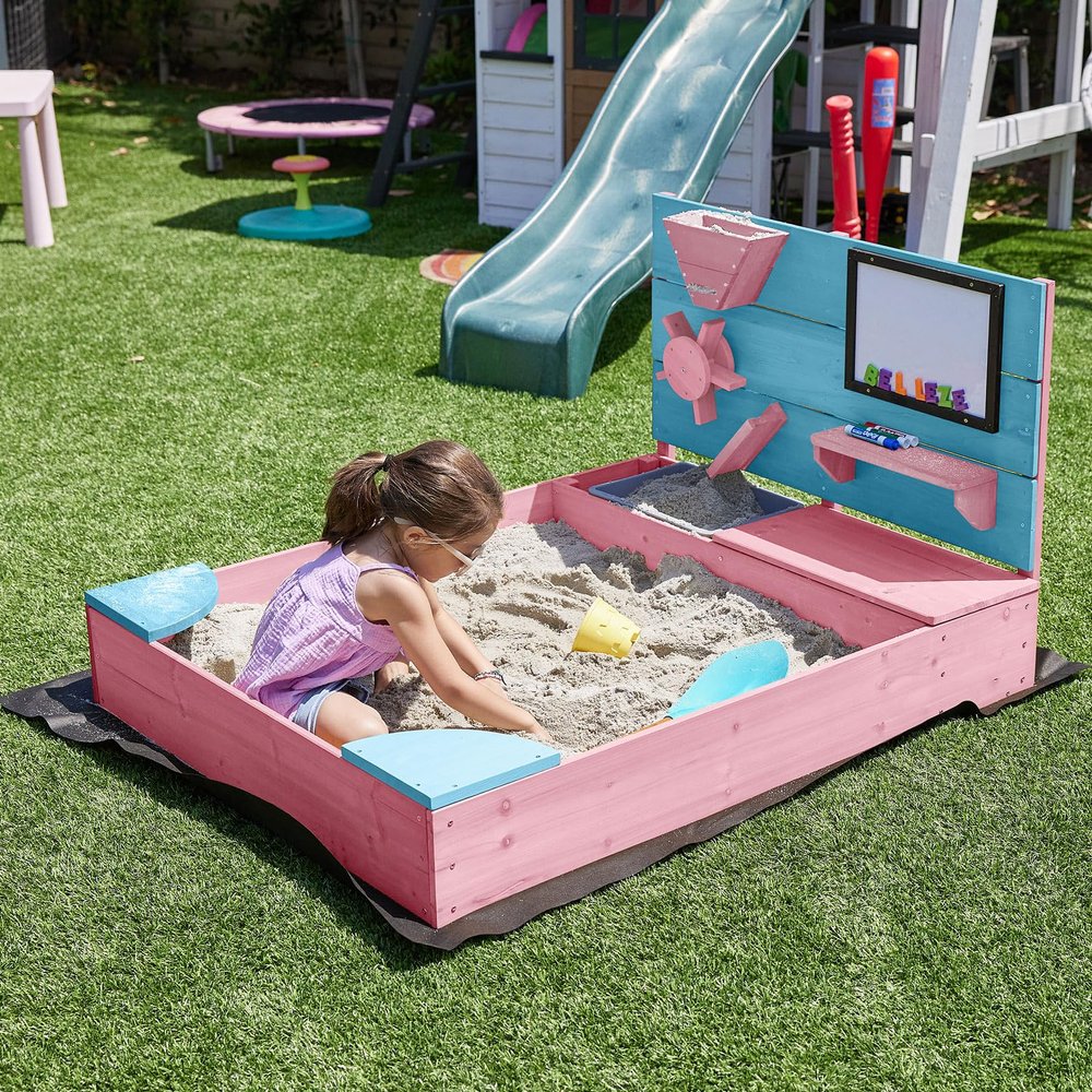BELLEZE Wooden Sandbox, 49x39in Kids Sand Pit for Backyard, Outdoor Sandbox with Cover and Bottom Liner, Built-in Corner Seating, Bench Storage, Sand Toy Wall and Magnetic White Board (Pink)