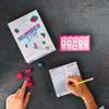 AEG Number Drop | Retro Roll & Write Polyomino Video Game Themed Board Game | Nostalgic & Quick to Play | 1-6 Players | Ages 10+ | 20 Minute Playtime view 4