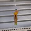 F680 - Greenhills Seated Female Spectator with Cap for Scalextric Carrera 1.32 Scale - NEW view 1