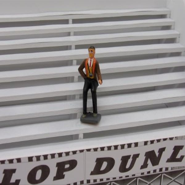 F822 Greenhills Seated Male Spectator for Scalextric Carrera 1.32 Scale - NEW