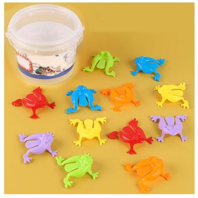 12Pcs Jumping Frog Toy, Press Frog Toy Colorful Frog Jumping Toys Finger Pressing Leaping Frogs with Bucket, Kids Party Favors Novelty Frogs Jumping Frog Bouncing Toy Set (Transparent Bucket)