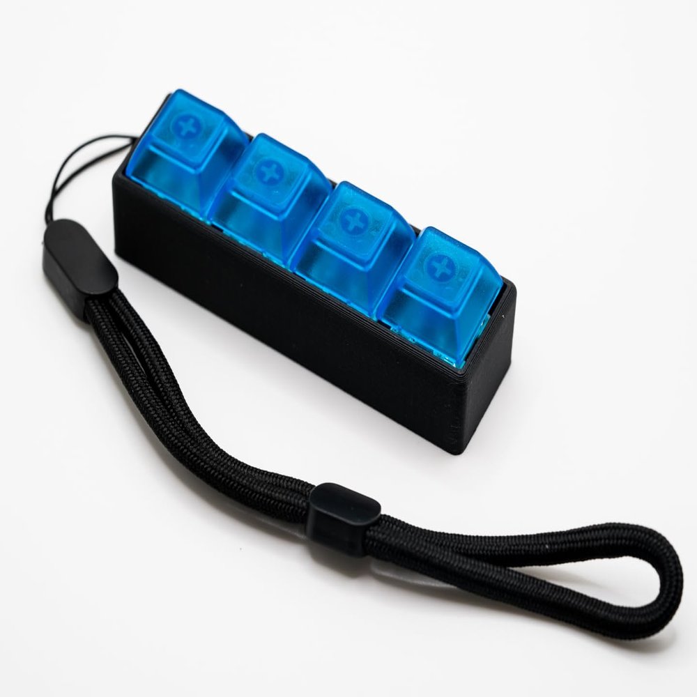 Four-Button Clicky Mechanical Switch Fidget Toy | Stim Toy, Stress Relief, ADHD (Black Base, Transparent Blue Keycaps)