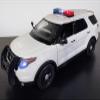 2015 Police Interceptor Utility White with Flashing Light Bar and Front and Rear Lights and 2 Sounds 1/18 Diecast Model Car by Motormax 73995 view 1
