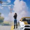 1/64 Scale Female Photographer Figure, Photo-Taking Female Figure - Dressed in Black Coat, Jeans and Boots, Standing Taking Photo Girl Figurine, Capturing Moments with Camera Figure Mini Statue view 4