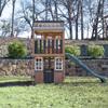 KidKraft Cliffbrook Wooden Outdoor Two-Story Playhouse with Slide view 3