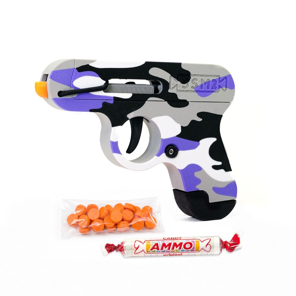 Toy Gun that Shoots Candy - The Smartee Shooter - Shoots Fast and Far - Over 40 feet & Over 70 fps. Working Magazine & Slide. 5 Packs of Candy & 20 Pieces of Plastic Ammo. (Purple Camo)