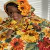 15-inch Decorative Doll in Sunflower Print Dress with Gold Trim and Floral Crown, Yellow and Red view 1