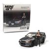 1:64 Diecast Model Car Compatible with Nissan Skyline GT-R (R32) Nismo Gunmetal W/Matsuda Figure Tsugio Matsuda Collection Limited Edition by Mini GT MGT00869 view 1
