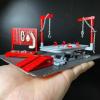 KiBcsLic 1/64 Garage Lift Kit Realistic SimulationMiniature Garage Pretend Play Toy Can Move up and Down DIY Car Repair Shop Scene view 3