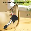 CIOURSTO Mini Guitar Finger Piano Keychain Portable Foldable Silicone Guitar Model with Sound Chips Playable for Kids Adults Musical Instrument Color Version (Black and White Version) view 2
