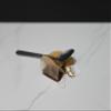 Fake Tea Bag and Spoon in a Puddle of Tea view 2