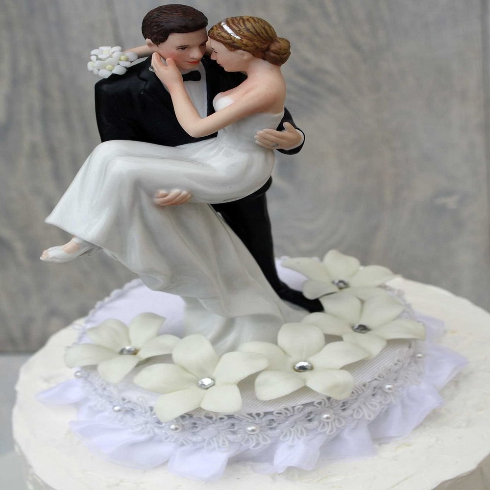 Stephanotis Groom Holding the Bride Wedding Cake Topper