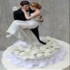Stephanotis Groom Holding the Bride Wedding Cake Topper view 1